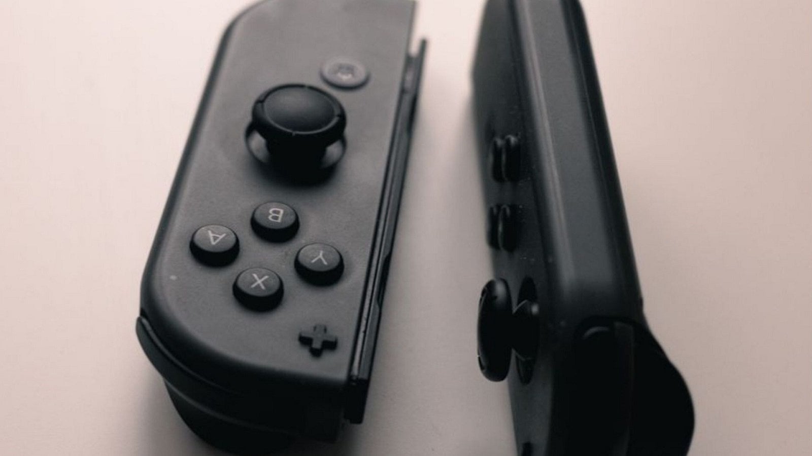 Nintendo Switch Joy-Con controllers detached from the console on a flat surface