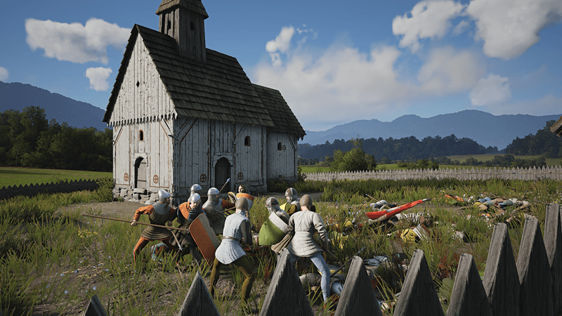 Manor Lords medieval city-building game with stone walls and townhouses