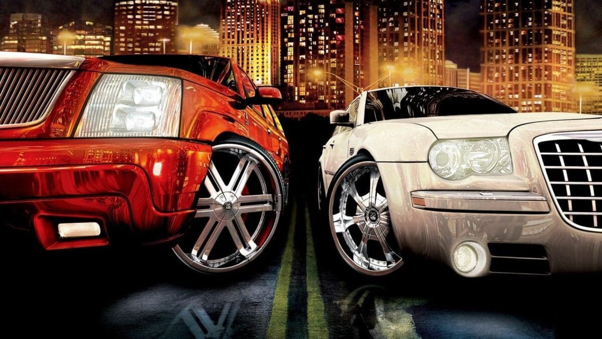 Midnight Club Los Angeles street racing gameplay with neon-lit city at night