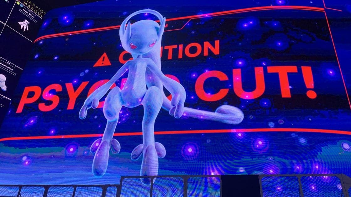 Mewtwo appearing on Times Square billboards during Pokémon Go 10th anniversary raid event