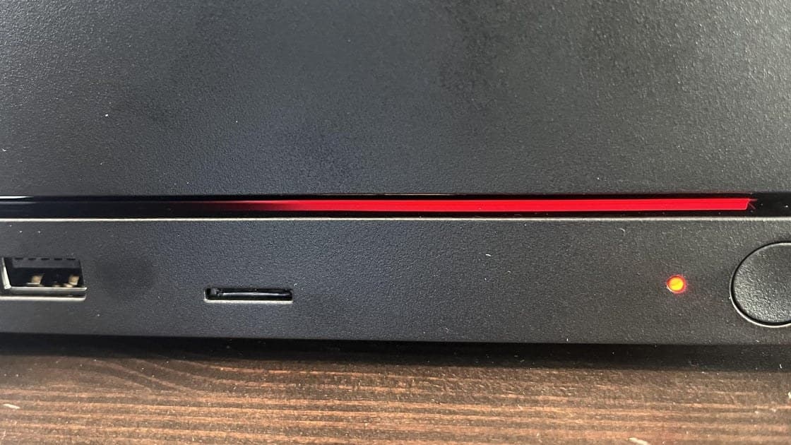 Steam Machine console displaying a red LED line indicating GPU failure on its light bar
