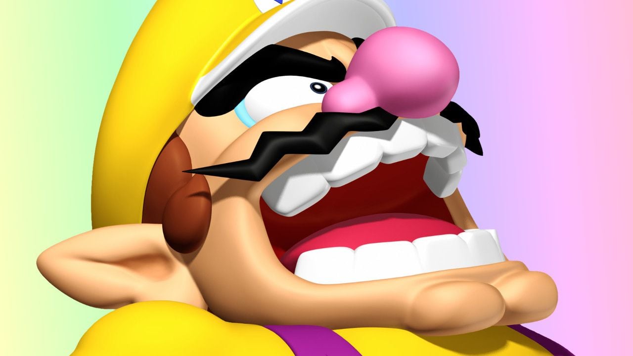 Wario grinning menacingly in front of a Nintendo Switch 2 console